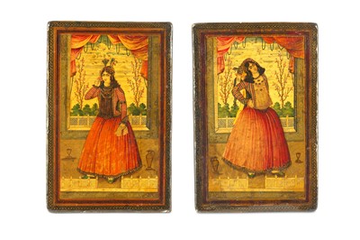Lot 145 - *A MATCHING PAIR OF QAJAR LACQUERED PAPIER-MÂCHÉ FIGURAL BOOKCOVERS