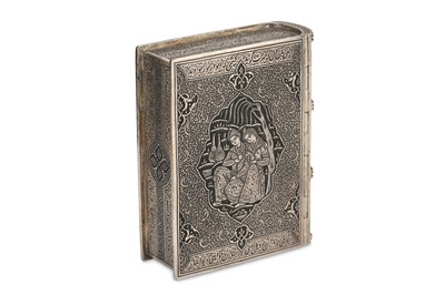 Lot 134 - *AN ENGRAVED SILVER MINIATURE POETRY BOOK HOLDER