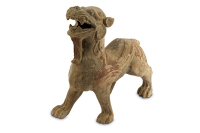 Lot 249 - A Chinese earthenware guardian, probably late...