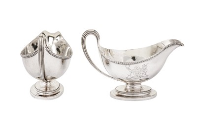 Lot 576 - A pair of George III sterling silver sauce boats, London 1784 by Edward Wakelin and William Taylor (reg. 25th Sep 1776)