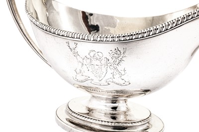 Lot 576 - A pair of George III sterling silver sauce boats, London 1784 by Edward Wakelin and William Taylor (reg. 25th Sep 1776)