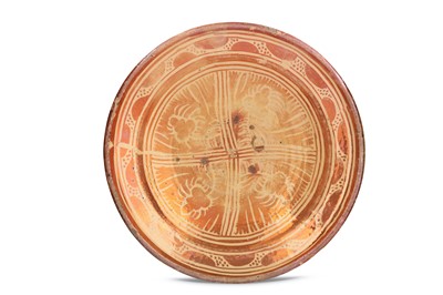 Lot 100 - AN HISPANO-MORESQUE COPPER-LUSTRE POTTERY DISH