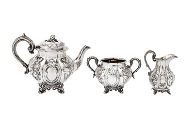 Lot 481 - A matched Victorian sterling silver three-piece tea service, the teapot and sugar bowl, Sheffield 1853 by Martin, Hall & Co