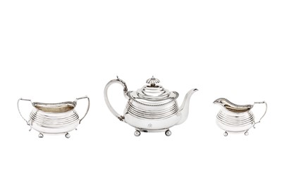 Lot 486 - A George III sterling silver three-piece tea service, London 1814 by Alice and George Burrows II (reg. 10th July 1801), overstriking that of Crispin Fuller (reg. 29th Dec 1792)