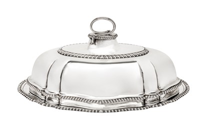 Lot 574 - A matched George II / George III sterling silver meat dish and cover, the base London 1748 by Charles Fredrick Kandler (reg. 10 Sep 1735)