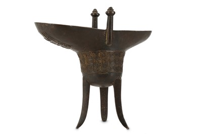 Lot 388 - A CHINESE BRONZE RITUAL ARCHAISTIC WINE VESSEL, JUE.