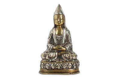 Lot 439 - A TIBETAN BRONZE AND SILVER FIGURE OF TSONGKAPA.