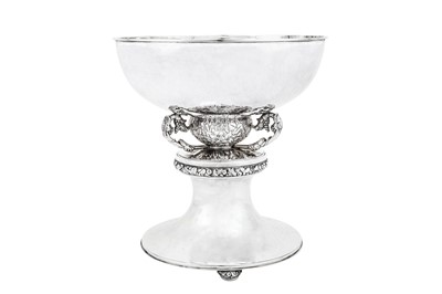 Lot 524 - A large George V ‘arts and crafts’ sterling silver bowl on stand, London 1935 by Charles Boyton