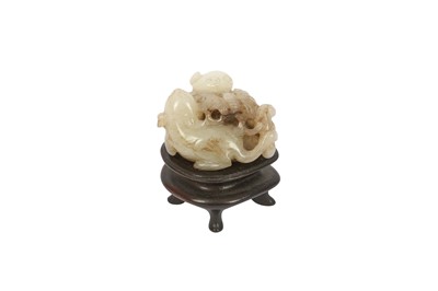 Lot 257 - A CHINESE PALE CELADON JADE 'CATS AND BUTTERFLY' CARVING.