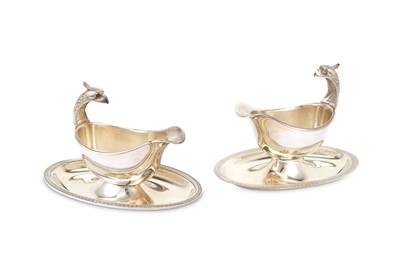 Lot 68 - A near pair of large French silver plated Christofle Malmaison pattern Royal eagle head gravy boats