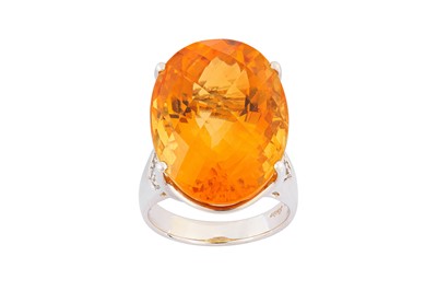 Lot 63 - A citrine and diamond ring