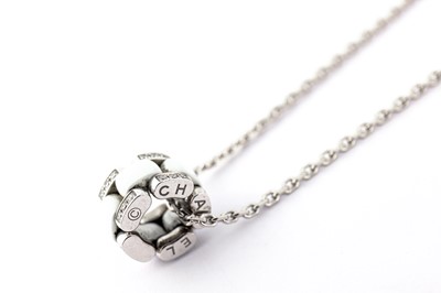 Lot 48 - A ceramic and diamond 'Ultra' pendant necklace, by Chanel