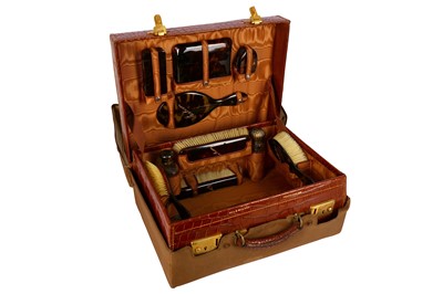 Lot 162 - A Hill and Millard crocodile skin travelling vanity case