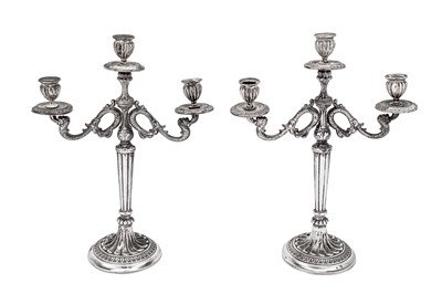 Lot 401 - A mid-20th century pair of Italian 800 standard silver three light candelabra, Vercilli 1944-68 by Angelo di Antonio Mascherpa