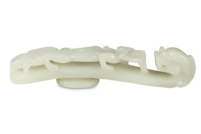 Lot 49 - A CHINESE WHITE JADE 'DRAGON' BELT HOOK.