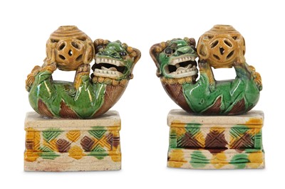 Lot 100 - A PAIR OF CHINESE SANCAI BUDDHIST 'LION DOG' JOSS STICK HOLDERS.