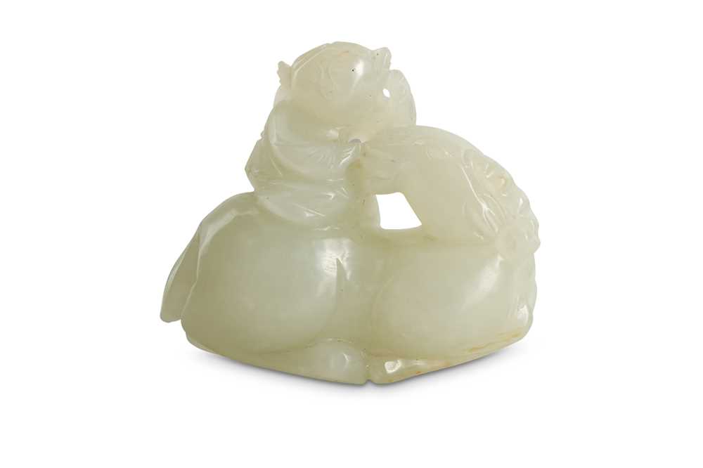 Lot 58 - A CHINESE WHITE JADE 'BOY AND RAM' CARVING.