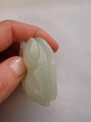 Lot 58 - A CHINESE WHITE JADE 'BOY AND RAM' CARVING.