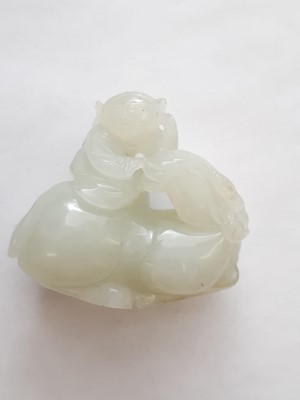 Lot 58 - A CHINESE WHITE JADE 'BOY AND RAM' CARVING.