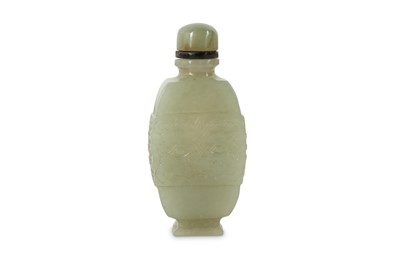 Lot 4 - A CHINESE PALE CELADON JADE 'TAOTIE MASK' SNUFF BOTTLE.