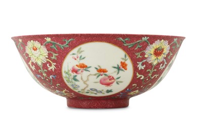 Lot 84 - A CHINESE FAMILLE ROSE RUBY-GROUND SGRAFFITO MEDALLION BOWL.