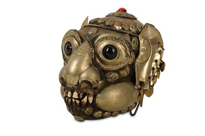 Lot 7 - TRIBAL: A TIBETAN WHITE METAL MOUNTED MONKEY SKULL
