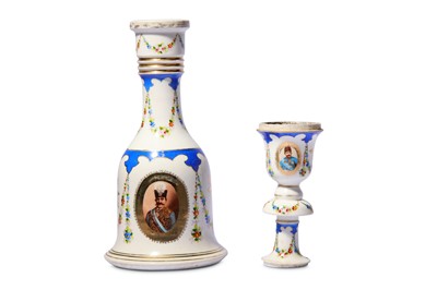 Lot 85 - * A PORCELAIN WATER PIPE (QALYAN) BOTTLE AND STEM CUP WITH PORTRAIT OF MUZAFFAR AL-DIN SHAH QAJAR
