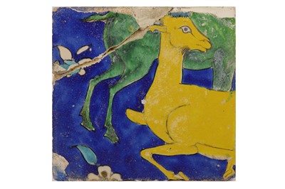 Lot 26 - * A SAFAVID CUERDA SECA POTTERY TILE WITH DEER