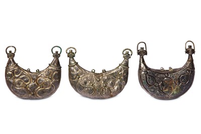 Lot 94 - * THREE SELJUK SILVER AND NIELLO PECTORAL AMULET CASES