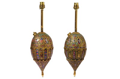 Lot 86 - * A NEAR PAIR OF QAJAR POLYCHROME-ENAMELLED GILT-COPPER QALYAN BOTTLES