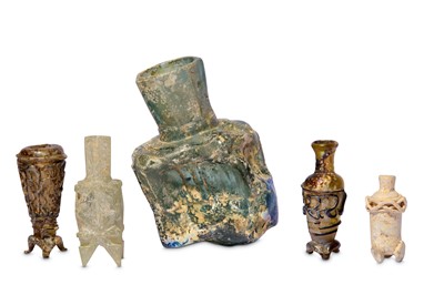 Lot 4 - * FOUR SMALL EARLY ISLAMIC GLASS OINTMENT FLASKS AND A MISFIRED BOTTLE