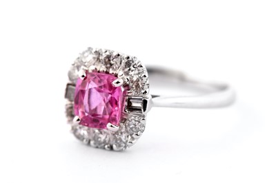 Lot 66 - A pink sapphire and diamond cluster ring