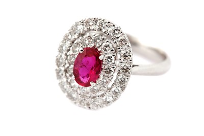 Lot 64 - A ruby and diamond target ring