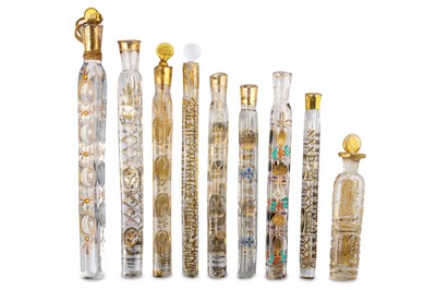 Lot 268 - NINE POLYCHROME-ENAMELLED AND GILT CLEAR-GLASS PERFUME BOTTLES