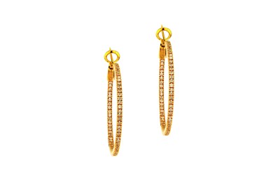 Lot 83 - A pair of diamond hoop earrings