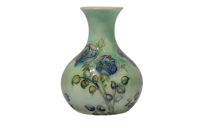 Lot 6 - WILLIAM MOORCROFT FOR LIBERTY & CO., a Tudor Rose miniature bottle vase