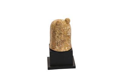 Lot 265 - λ AN EARLY ISLAMIC CARVED IVORY CHESSPIECE
