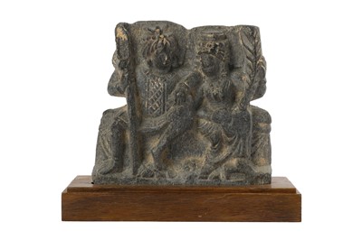 Lot 158 - A GREY SCHIST RELIEF FRAGMENT OF HARITI AND PANCHIKA