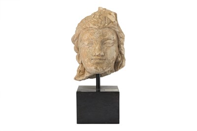 Lot 160 - A SMALL STUCCO BODHISATTVA HEAD