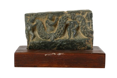 Lot 177 - A SMALL GREY SCHIST FRIEZE RELIEF WITH GARLANDS AND CHERUBS
