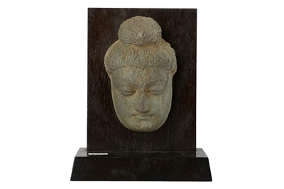 Lot 168 - A CARVED GREY SCHIST BUDDHA HEAD