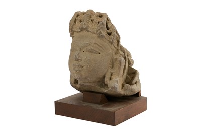 Lot 186 - A BUFF SANDSTONE HEAD OF A GODDESS OR APSARA