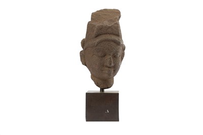 Lot 184 - A GRANITE HEAD OF A HINDU GOD