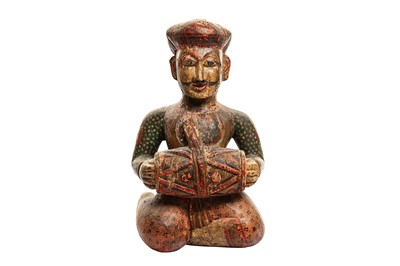 Lot 227 - A CARVED AND PAINTED WOODEN FIGURE OF A RAJASTHANI TABLA DRUMMER