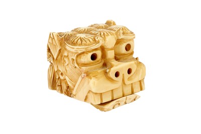 Lot 336 - A Meiji period Japanese ivory lion dog (Shishi) netsuke