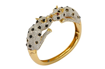 Lot 36 - An onyx and diamond hinged bangle