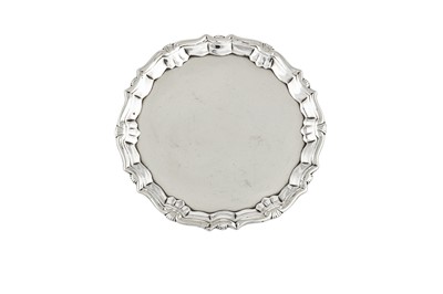 Lot 292 - A George II sterling silver teapot stand or waiter, London 1744 by Robert Abercromby (first mark alone reg. 5th Oct 1731)