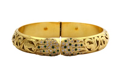 Lot 4 - A gem-set hinged bangle