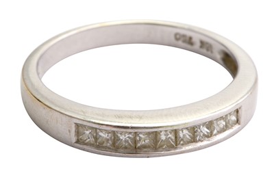 Lot 9 - A diamond half hoop ring