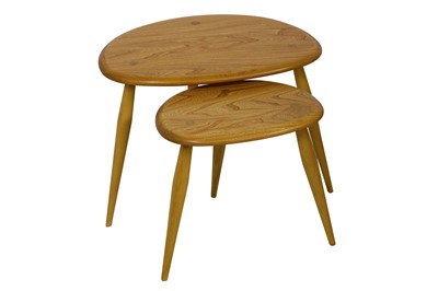 Lot 158 - Ercol, a pair of blonde elm Pebble nesting tables